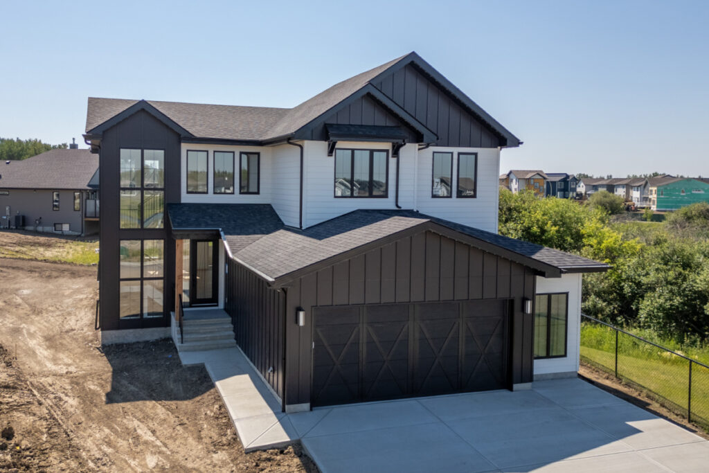 Modern residential home representing the importance of routine exterior maintenance for siding, gutters, and masonry.