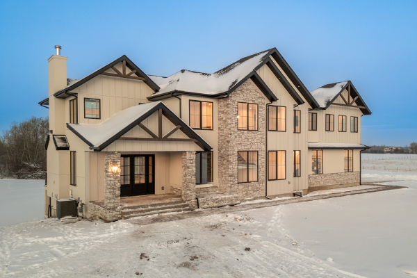 Cream-colored custom home featuring clean exterior lines, representing architectural siding options for modern design.