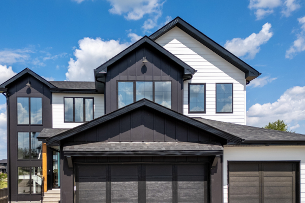 Modern black and white residential home reflecting the exterior craftsmanship and siding services of Great Albertan Exteriors.