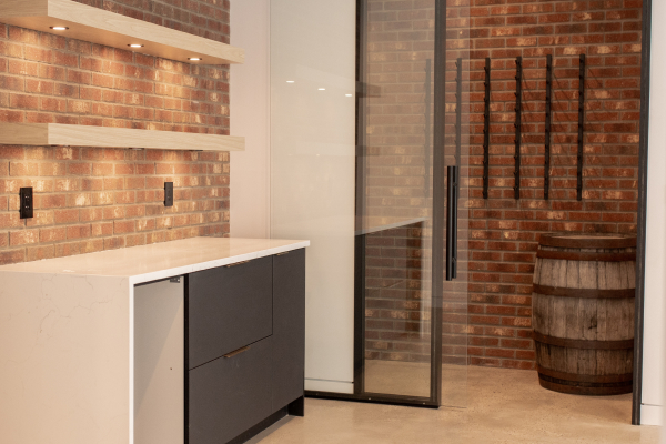 Interior view of modern space with brick masonry feature wall, showcasing quality craftsmanship and durable design.